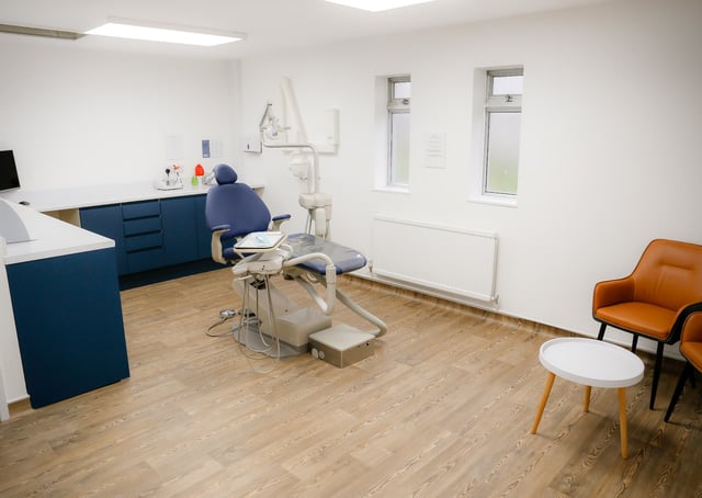 An Astro Dental surgery with a blue dental chair